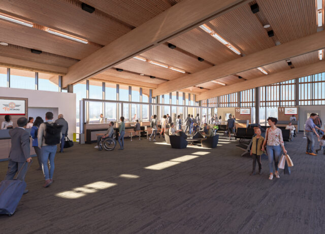Passengers walk through a spacious airport terminal with high wooden ceilings and ample natural light.
